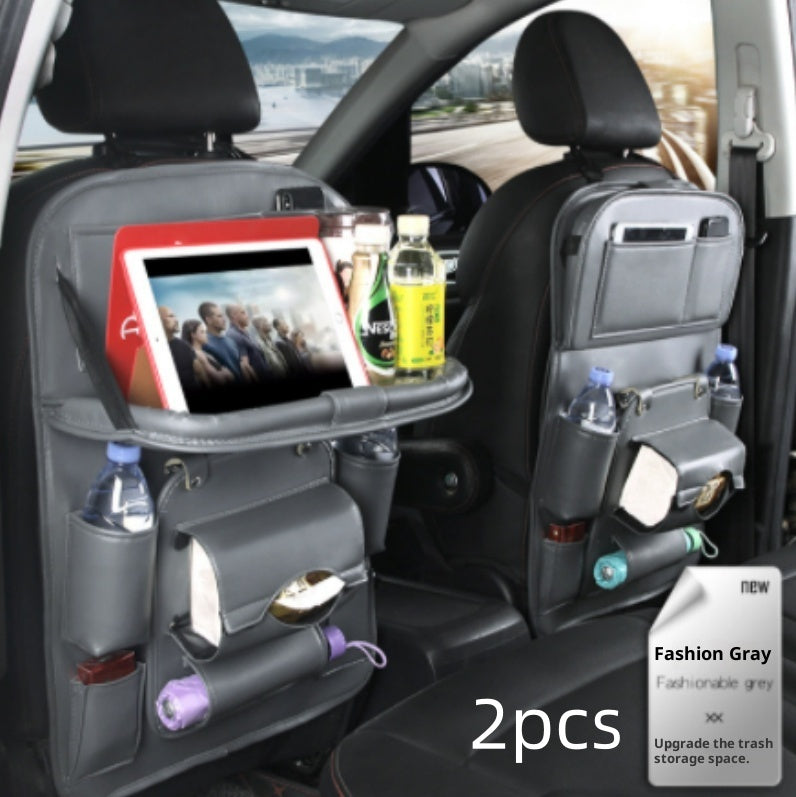Car back seat organizer with tablet stand and drink holders in a vehicle.