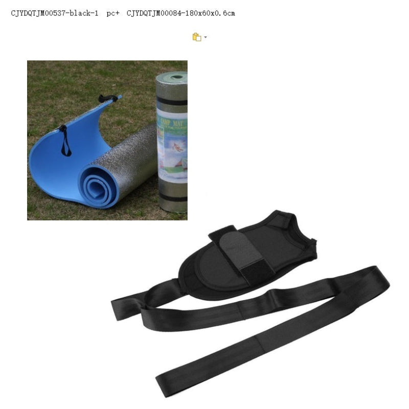 Black strap with a small inset of a blue mat and roll of paper on grass.