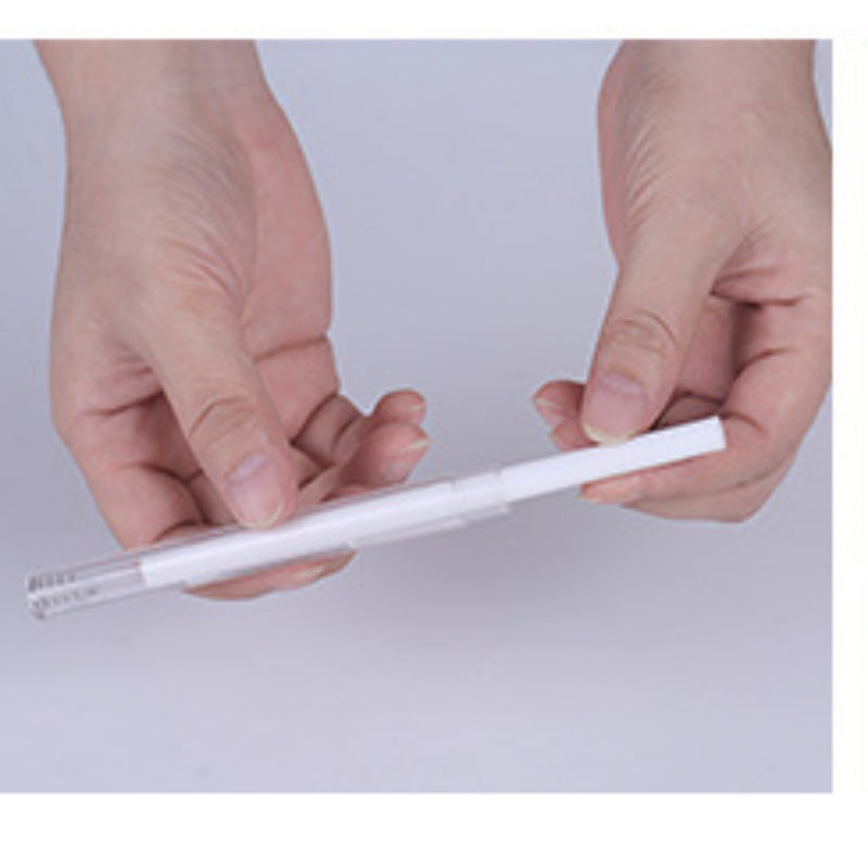 Two hands holding a white pen against a light gray background