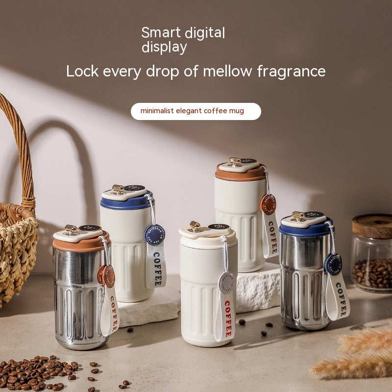 Set of coffee mugs with smart digital display and mellow fragrance on a neutral background.