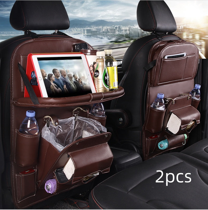 Car seat organizer with multiple pockets and a tablet stand, placed in a car interior.