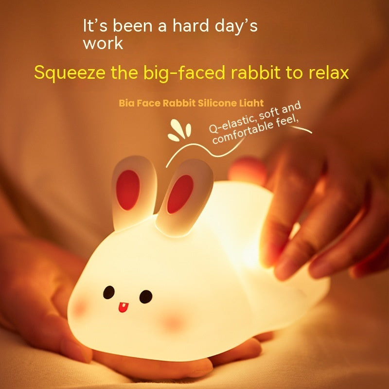 Silicone rabbit light being squeezed with text about relaxing after a hard day