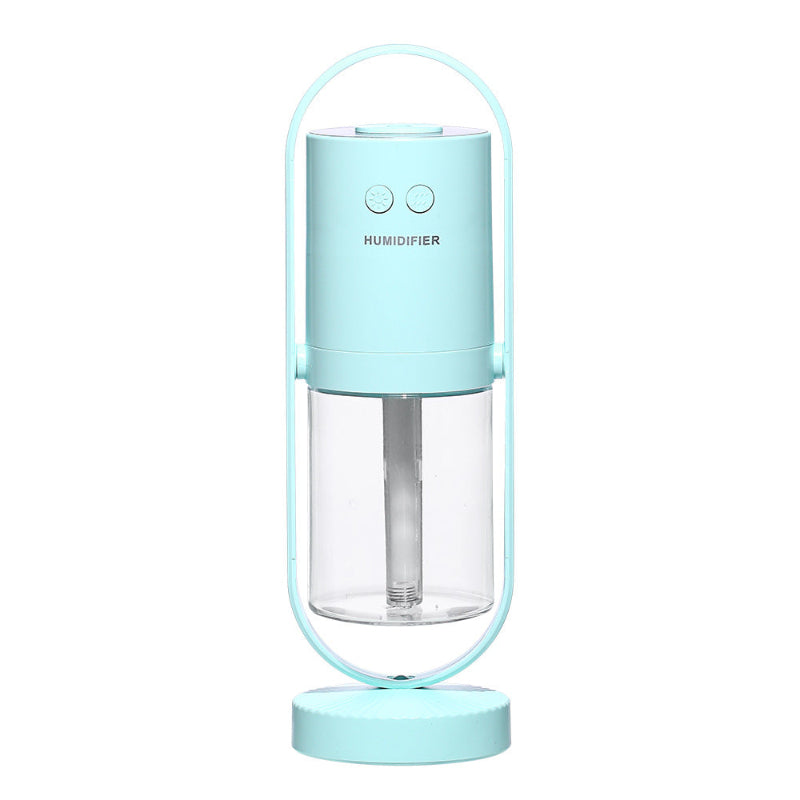 Portable humidifier with a light blue top and base on a white background