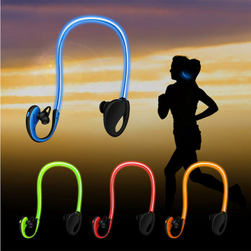Glowing LED earbuds with a silhouette of a person running against a sunset background.
