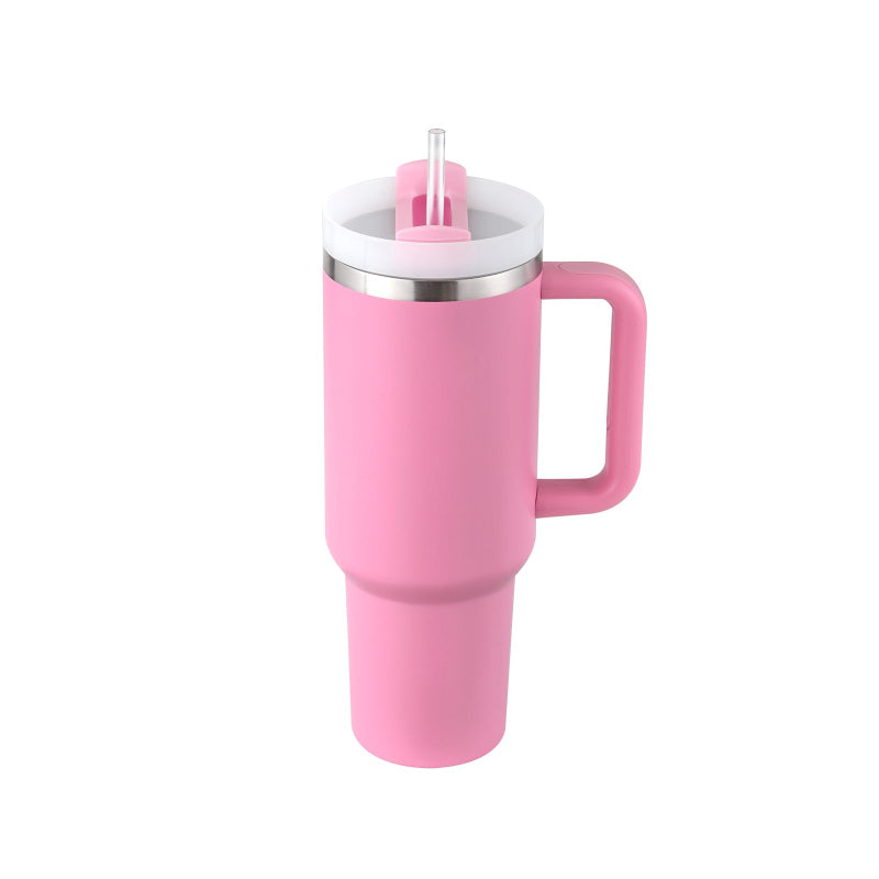Pink insulated mug with handle and straw lid on a white background