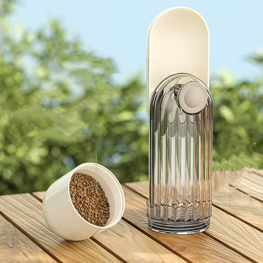 Pet feeder and water bottle set on a wooden surface with a blurred natural background
