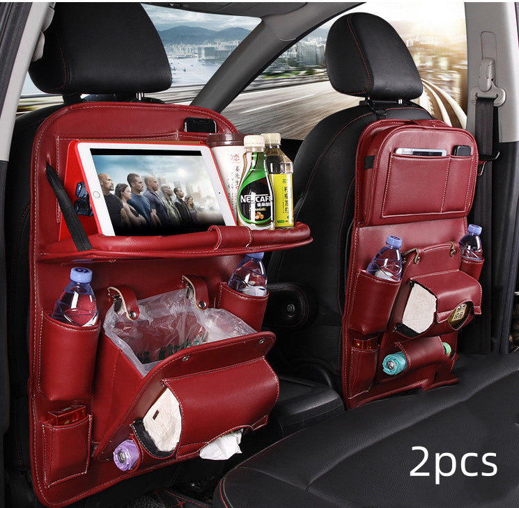 Red car seat back organizers with multiple pockets and a tablet stand, placed in a car interior.